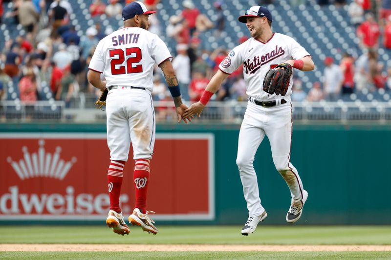 Apr 16, 2023; Washington, District of Columbia, USA; Washington Nationals first baseman Dominic Smith (22) celebrates with Nationals right fielder Lane Thomas (28) after their game against the Cleveland Guardians at Nationals Park. Mandatory Credit: Geoff Burke-USA TODAY Sports