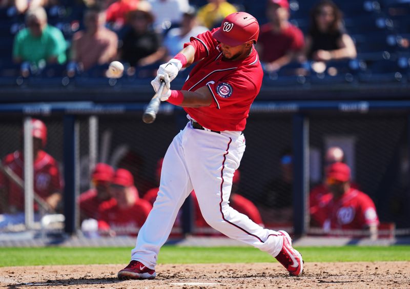 Feb 26, 2023; West Palm Beach, Florida, USA; Washington Nationals catcher Keibert Ruiz (20) singles to center field in the third inning against the Houston Astros at The Ballpark of the Palm Beaches. Mandatory Credit: Jim Rassol-USA TODAY Sports