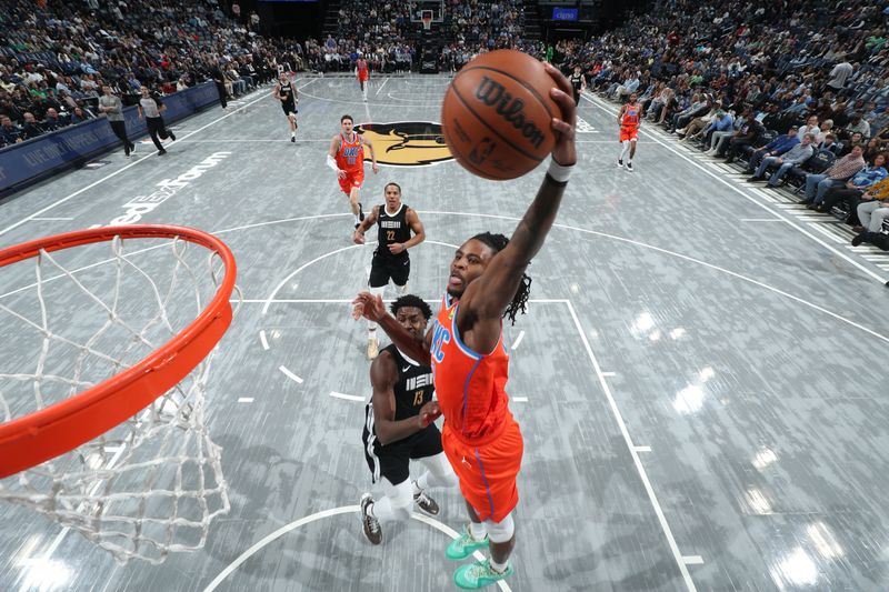 MEMPHIS, TN - MARCH 16: Cason Wallace #22 of the Oklahoma City Thunder  drives to the basket during the game against the Memphis Grizzlies on March 16, 2024 at FedExForum in Memphis, Tennessee. NOTE TO USER: User expressly acknowledges and agrees that, by downloading and or using this photograph, User is consenting to the terms and conditions of the Getty Images License Agreement. Mandatory Copyright Notice: Copyright 2024 NBAE (Photo by Joe Murphy/NBAE via Getty Images)