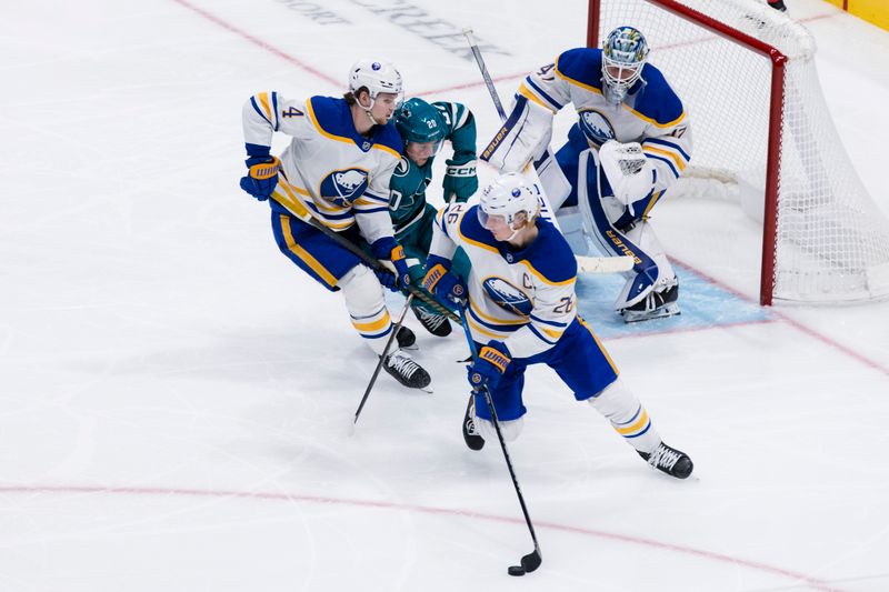 Nov 23, 2024; San Jose, California, USA; Buffalo Sabres defenseman Rasmus Dahlin (26) clears the puck against the San Jose Sharks during the third period at SAP Center in San Jose. Mandatory Credit: John Hefti-Imagn Images