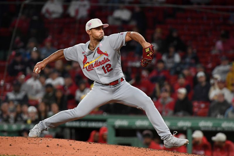 May 14, 2023; Boston, Massachusetts, USA; St. Louis Cardinals relief pitcher Jordan Hicks (12) pitches against the Boston Red Sox during the eighth inning at Fenway Park. Mandatory Credit: Eric Canha-USA TODAY Sports