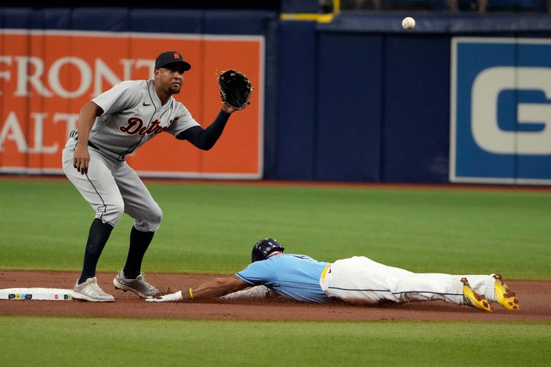 Apr 2, 2023; St. Petersburg, Florida, USA; Tampa Bay Rays shortstop Wander Franco (5) steals second base as Detroit Tigers second baseman Jonathan Schoop (7) tries to make the tag during the first inning at Tropicana Field. Mandatory Credit: Dave Nelson-USA TODAY Sports