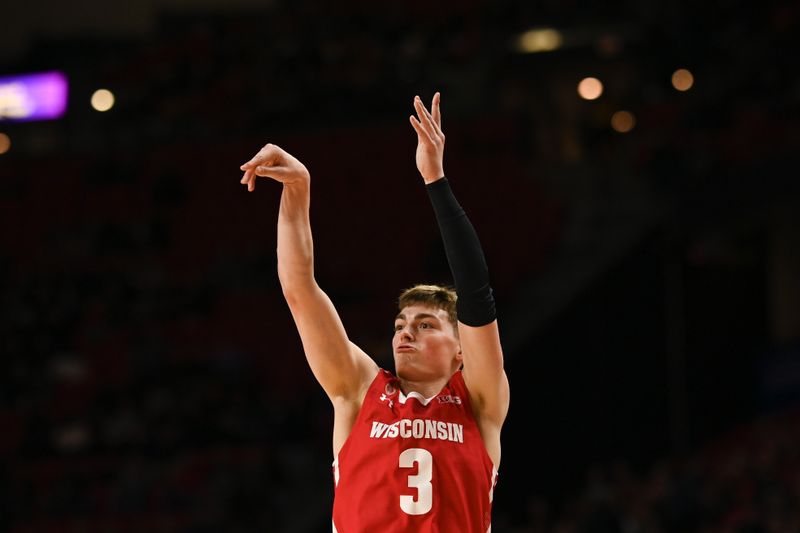 Jan 25, 2023; College Park, Maryland, USA;  Wisconsin Badgers guard Connor Essegian (3) follows through on a three point shot during the first half against the Maryland Terrapins at Xfinity Center. Mandatory Credit: Tommy Gilligan-USA TODAY Sports