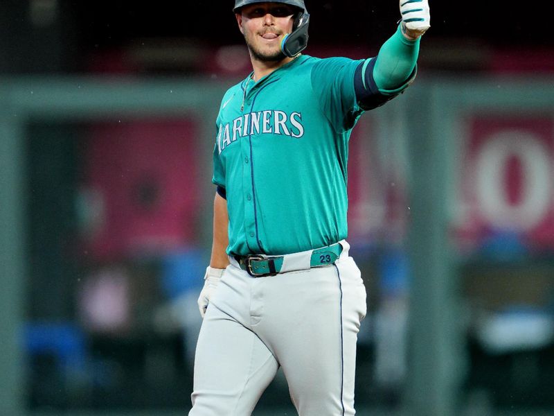 Jun 7, 2024; Kansas City, Missouri, USA; Seattle Mariners first baseman Ty France (23) gestures to the dugout after hitting an RBI double during the fourth inning against the Kansas City Royals at Kauffman Stadium. Mandatory Credit: Jay Biggerstaff-USA TODAY Sports