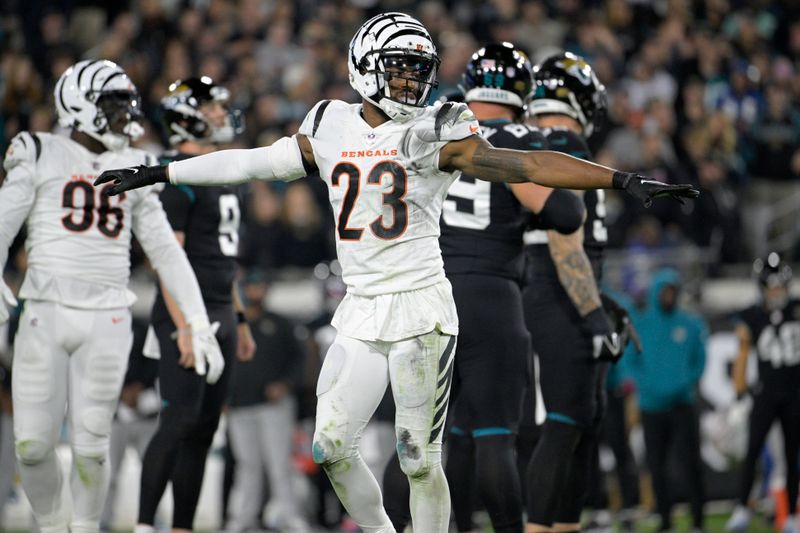 Cincinnati Bengals safety Dax Hill (23) reacts after a missed field goal by Jacksonville Jaguars place kicker Brandon McManus during the second half of an NFL football game, Monday, Dec. 4, 2023, in Jacksonville, Fla. (AP Photo/Phelan M. Ebenhack)