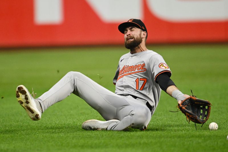 Aug 2, 2024; Cleveland, Ohio, USA; Baltimore Orioles left fielder Colton Cowser (17) can not catch an RBI double hit by Cleveland Guardians first baseman Josh Naylor (not pictured) during the fifth inning at Progressive Field. Mandatory Credit: Ken Blaze-USA TODAY Sports