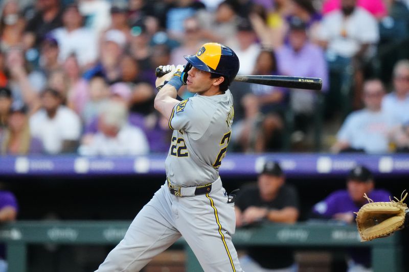 Jul 2, 2024; Denver, Colorado, USA; Milwaukee Brewers outfielder Christian Yelich (22) doubles in the third inning against the Colorado Rockies at Coors Field. Mandatory Credit: Ron Chenoy-USA TODAY Sports