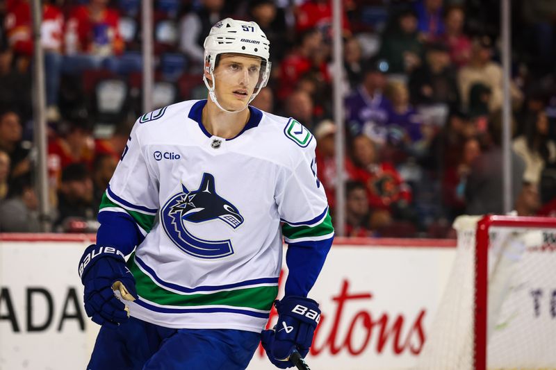 Oct 1, 2025; Calgary, Alberta, CAN; Vancouver Canucks defenseman Tyler Myers (57) skates during the second period against the Calgary Flames at Scotiabank Saddledome. Mandatory Credit: Sergei Belski-Imagn Images