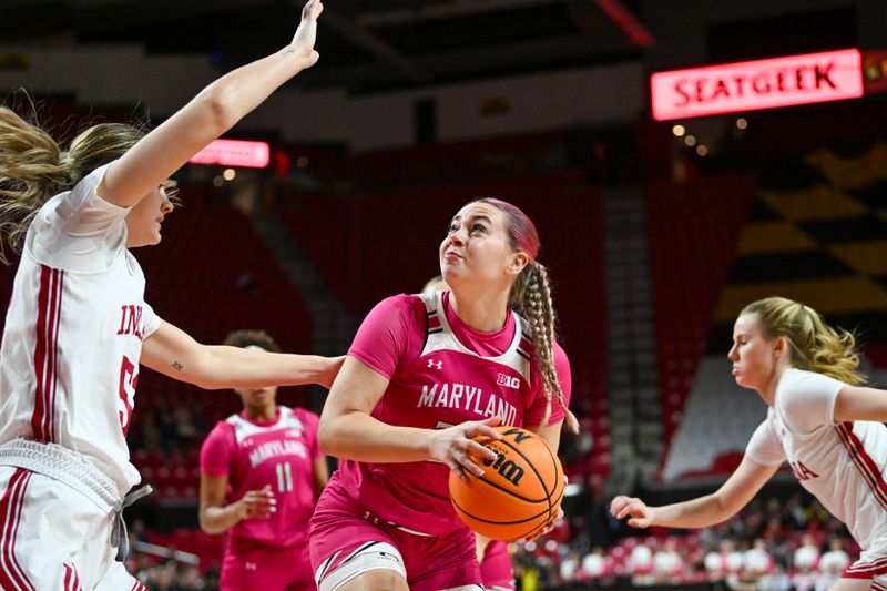 Jan 31, 2024; College Park, Maryland, USA;  Maryland Terrapins guard Emily Fisher (34) looks to shoot as Indiana Hoosiers forward Lilly Meister (52) defends during the second half at Xfinity Center. Mandatory Credit: Tommy Gilligan-USA TODAY Sports