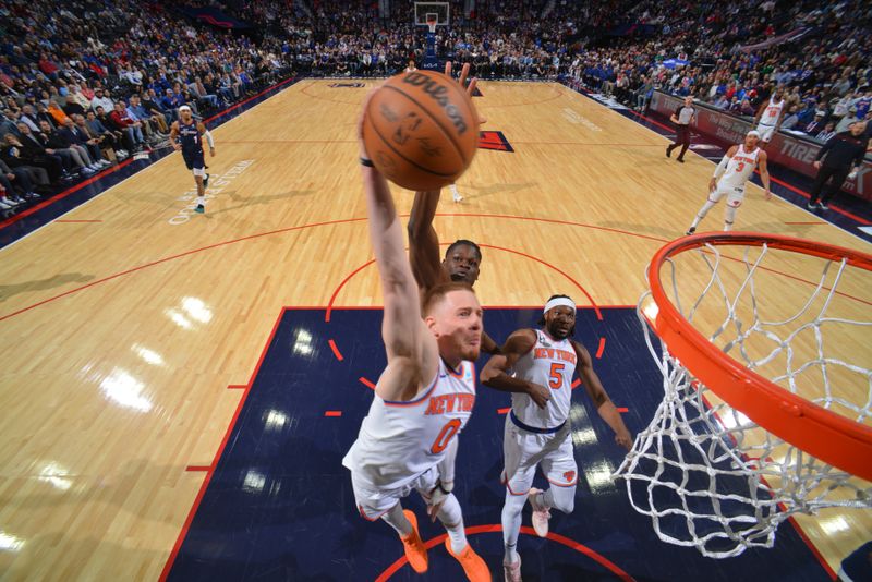 PHILADELPHIA, PA - FEBRUARY 22: Donte Divincenzo #0 of the New York Knicks drives to the basket during the game against the Philadelphia 76ers on February 22, 2024 at the Wells Fargo Center in Philadelphia, Pennsylvania NOTE TO USER: User expressly acknowledges and agrees that, by downloading and/or using this Photograph, user is consenting to the terms and conditions of the Getty Images License Agreement. Mandatory Copyright Notice: Copyright 2024 NBAE (Photo by Jesse D. Garrabrant/NBAE via Getty Images)