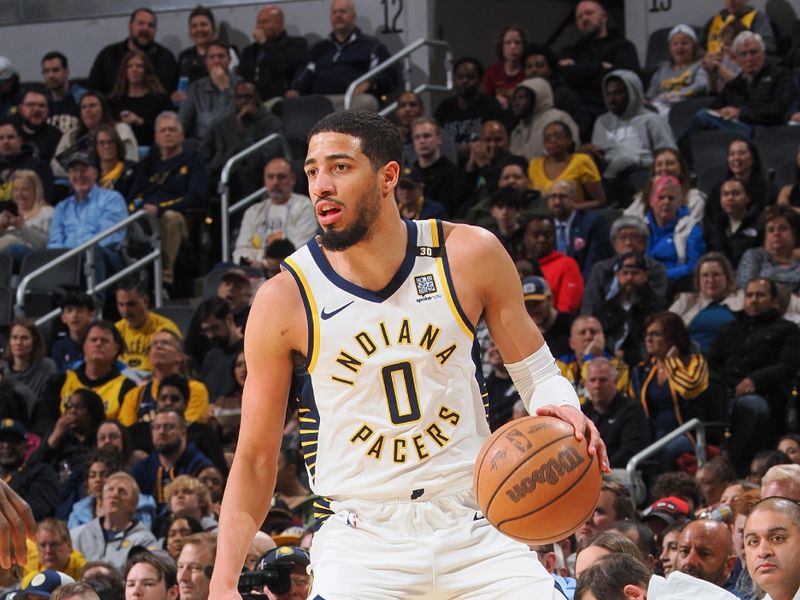 INDIANAPOLIS, IN - MARCH 18:  Tyrese Haliburton #0 of the Indiana Pacers handles the ball during the game  on March 18, 2024 at Gainbridge Fieldhouse in Indianapolis, Indiana. NOTE TO USER: User expressly acknowledges and agrees that, by downloading and or using this Photograph, user is consenting to the terms and conditions of the Getty Images License Agreement. Mandatory Copyright Notice: Copyright 2024 NBAE (Photo by Ron Hoskins/NBAE via Getty Images)