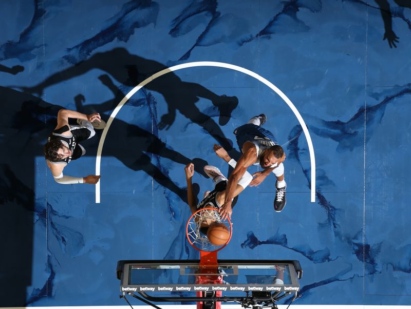 MINNEAPOLIS, MN -  FEBRUARY 27: Rudy Gobert #27 of the Minnesota Timberwolves dunks the ball during the game against the San Antonio Spurs on February 27, 2024 at Target Center in Minneapolis, Minnesota. NOTE TO USER: User expressly acknowledges and agrees that, by downloading and or using this Photograph, user is consenting to the terms and conditions of the Getty Images License Agreement. Mandatory Copyright Notice: Copyright 2024 NBAE (Photo by David Sherman/NBAE via Getty Images)