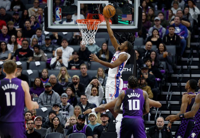 SACRAMENTO, CALIFORNIA - JANUARY 01: Tyrese Maxey #0 of the Philadelphia 76ers drives to the basket for a layup against the Sacramento Kings during the first half of an NBA basketball game at Golden 1 Center on January 01, 2025 in Sacramento, California. NOTE TO USER: User expressly acknowledges and agrees that, by downloading and or using this photograph, User is consenting to the terms and conditions of the Getty Images License Agreement. (Photo by Thearon W. Henderson/Getty Images)