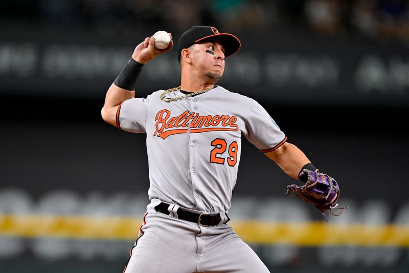 Jun 30, 2025; Arlington, Texas, USA; Baltimore Orioles third baseman Ramon Urias (29) throws out Texas Rangers center fielder Sam Haggerty (not pictured) during the third inning at Globe Life Field. Mandatory Credit: Jerome Miron-Imagn Images