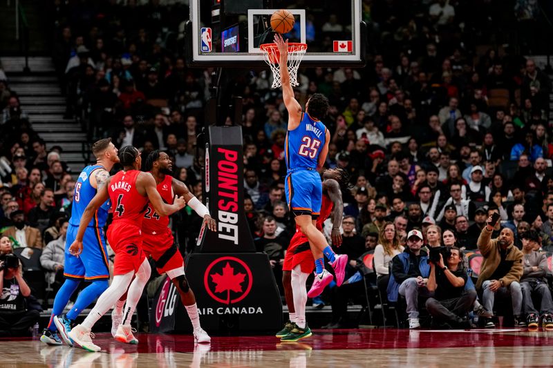 TORONTO, ON - DECEMBER 05: Ajay Mitchell #25 of the Oklahoma City Thunder drives to the basket against the Toronto Raptors at Scotiabank Arena on December 5, 2024 in Toronto, Ontario, Canada. NOTE TO USER: User expressly acknowledges and agrees that, by downloading and/or using this Photograph, user is consenting to the terms and conditions of the Getty Images License Agreement. (Photo by Andrew Lahodynskyj/Getty Images)