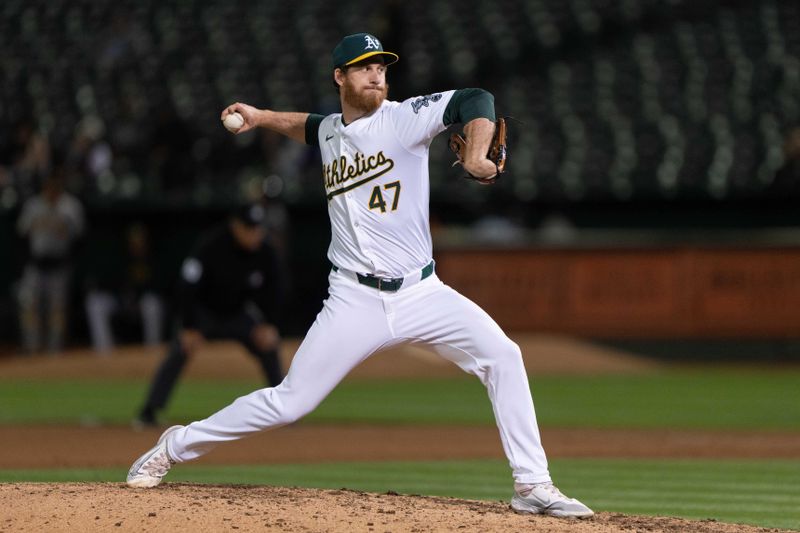 Apr 29, 2024; Oakland, California, USA; Oakland Athletics pitcher Michael Kelly (47) pitches during the ninth inning against the Pittsburgh Pirates at Oakland-Alameda County Coliseum. Mandatory Credit: Stan Szeto-USA TODAY Sports