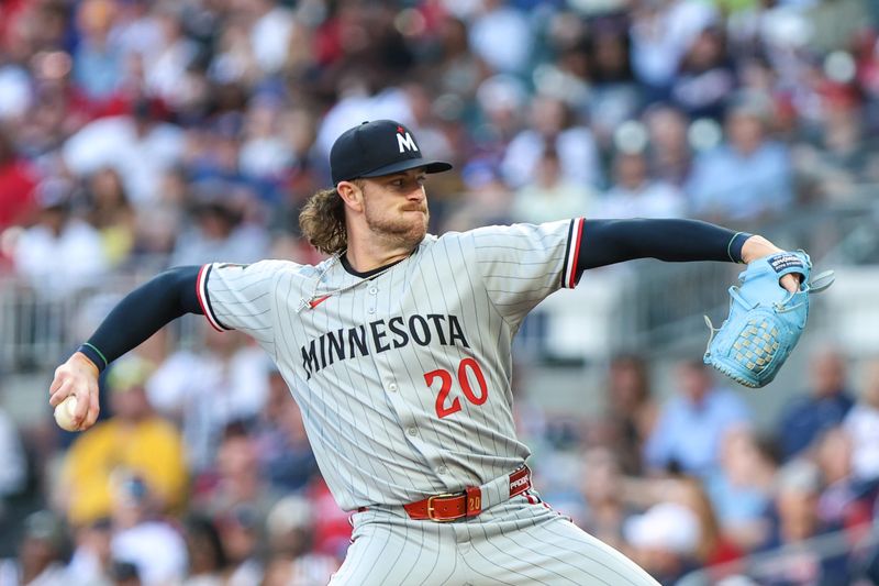 Apr 18, 2025; Cumberland, Georgia, USA; Minnesota Twins pitcher Chris Paddack (20) pitches against the Atlanta Braves during the first inning at Truist Park. Mandatory Credit: Jordan Godfree-Imagn Images