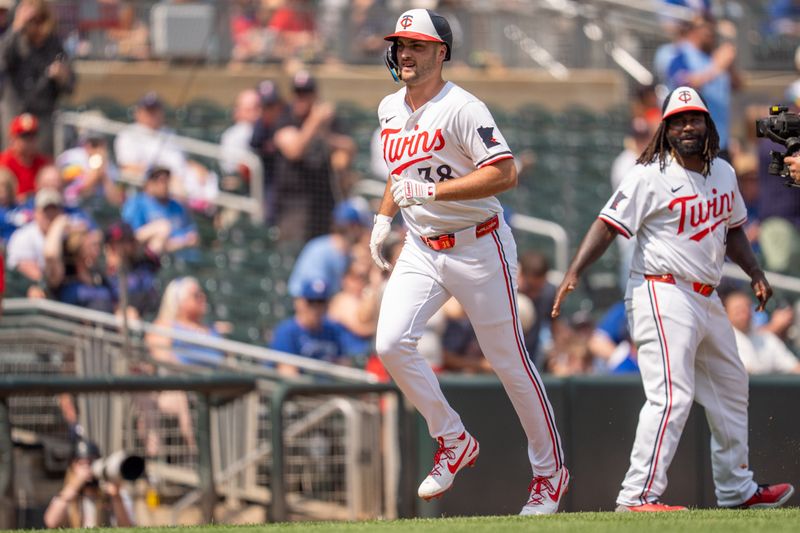 Jun 7, 2025; Minneapolis, Minnesota, USA; Minnesota Twins outfielder Matt Wallner (38) celebrates hitting a home run off Toronto Blue Jays starting pitcher Kevin Gausman (34) in the sixth inning at Target Field. Mandatory Credit: Matt Blewett-Imagn Images