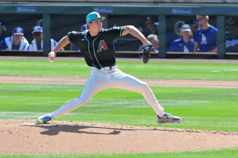Feb 25, 2026; Salt River Pima-Maricopa, Arizona, USA; Arizona Diamondbacks pitcher Drey Jameson (99) throws in the second inning against the Los Angeles Dodgers at Salt River Fields at Talking Stick. Mandatory Credit: Matt Kartozian-Imagn Images