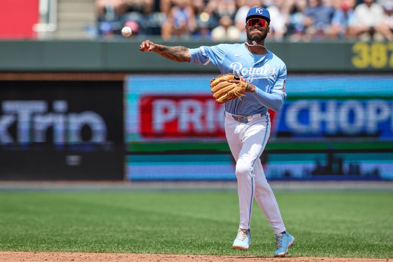 Jun 30, 2024; Kansas City, Missouri, USA; Kansas City Royals third base Maikel Garcia (11) throws to first base during the third inning against the Cleveland Guardians at Kauffman Stadium. Mandatory Credit: William Purnell-USA TODAY Sports