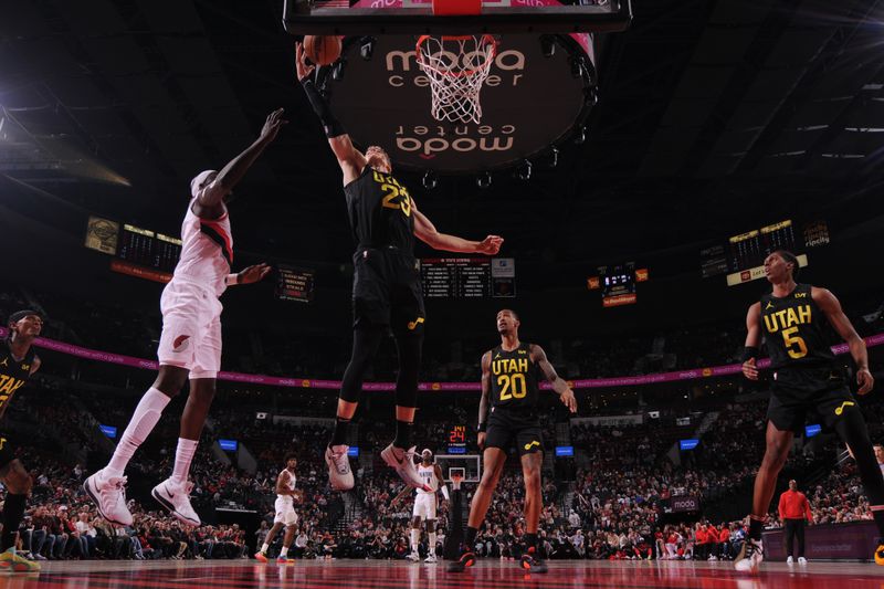 PORTLAND, OR - OCTOBER 18: Lauri Markkanen #23 of the Utah Jazz grabs the rebound during the game against the Portland Trail Blazers on October 18, 2024 at the Moda Center Arena in Portland, Oregon. NOTE TO USER: User expressly acknowledges and agrees that, by downloading and or using this photograph, user is consenting to the terms and conditions of the Getty Images License Agreement. Mandatory Copyright Notice: Copyright 2024 NBAE (Photo by Cameron Browne/NBAE via Getty Images)