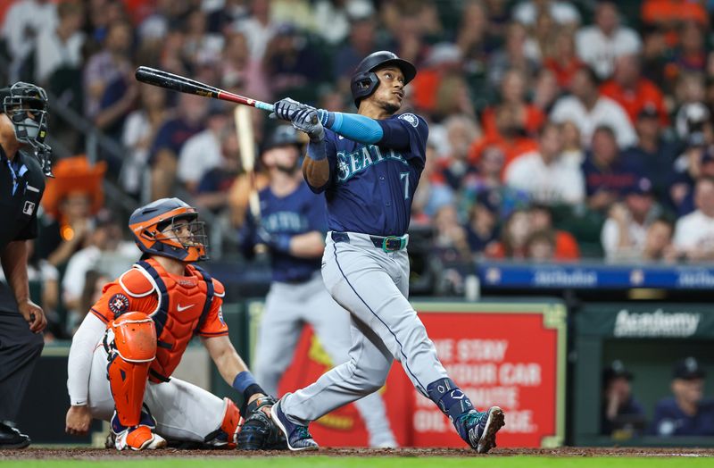 May 3, 2024; Houston, Texas, USA; Seattle Mariners second baseman Jorge Polanco (7) hits a home run during the third inning against the Houston Astros at Minute Maid Park. Mandatory Credit: Troy Taormina-USA TODAY Sports