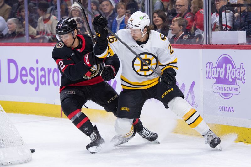 Nov 13, 2025; Ottawa, Ontario, CAN; Ottawa Senators center Shane Pinto (12) battles with Boston Bruins defenseman Andrew Peeke (26) in the first period at the Canadian Tire Centre. Mandatory Credit: Marc DesRosiers-IMAGN Images