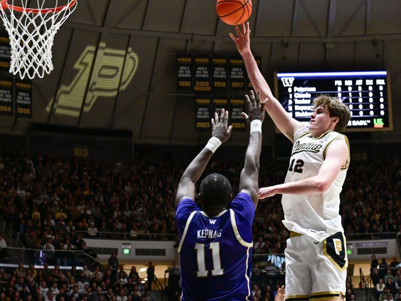 Jan 7, 2026; West Lafayette, Indiana, USA; Purdue Boilermakers center Daniel Jacobsen (12) shoots the ball over Washington Huskies center Franck Kepnang (11) during the second half at Mackey Arena. Mandatory Credit: Marc Lebryk-Imagn Images