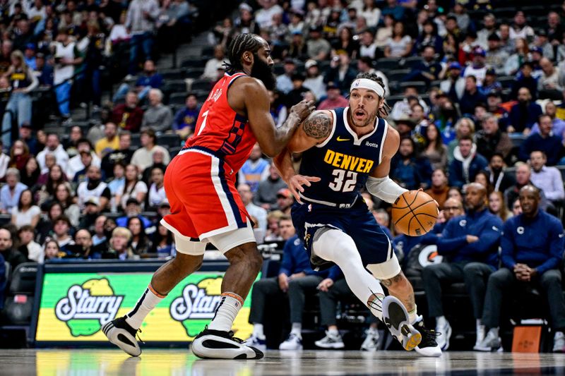 DENVER, COLORADO - DECEMBER 13: Aaron Gordon #32 of the Denver Nuggets is defended by James Harden #1 of the LA Clippers in the first half of a game at Ball Arena on December 13, 2024, 2024 in Denver, Colorado. NOTE TO USER: User expressly acknowledges and agrees that, by downloading and or using this photograph, User is consenting to the terms and conditions of the Getty Images License Agreement. (Photo by Dustin Bradford/Getty Images)