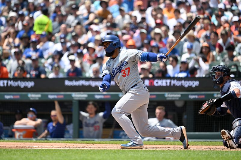 Jul 14, 2024; Detroit, Michigan, USA;  Los Angeles Dodgers left fielder Teoscar Hernández (37) drives in a run with a double down the left field line against the Detroit Tigers  in the first inning at Comerica Park. Mandatory Credit: Lon Horwedel-USA TODAY Sports