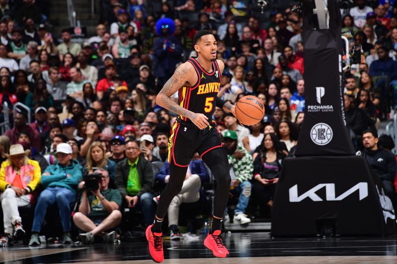 LOS ANGELES, CA - MARCH 17: Dejounte Murray #5 of the Atlanta Hawks dribbles the ball during the game against the LA Clippers on March 17, 2024 at Crypto.Com Arena in Los Angeles, California. NOTE TO USER: User expressly acknowledges and agrees that, by downloading and/or using this Photograph, user is consenting to the terms and conditions of the Getty Images License Agreement. Mandatory Copyright Notice: Copyright 2024 NBAE (Photo by Adam Pantozzi/NBAE via Getty Images)