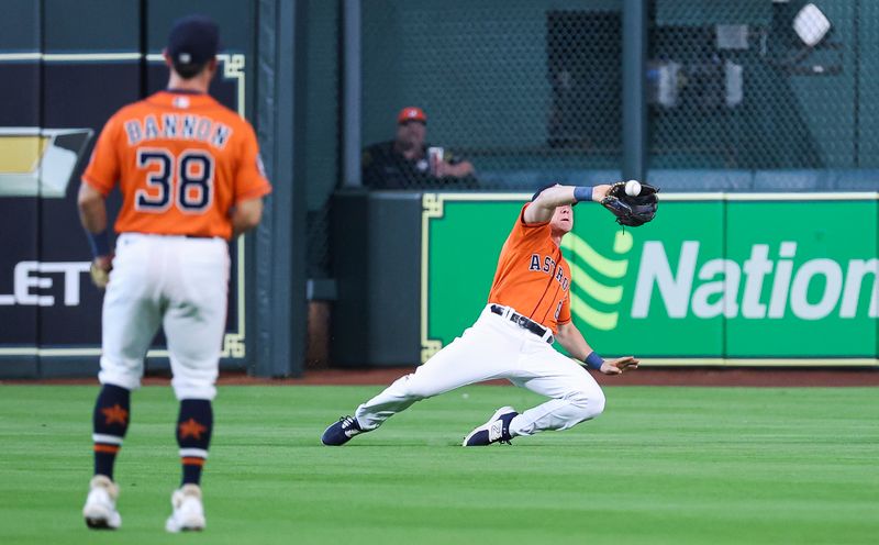 Apr 30, 2023; Houston, Texas, USA; Houston Astros center fielder Jake Meyers (6) slides to catch a fly ball during the second inning against the Philadelphia Phillies at Minute Maid Park. Mandatory Credit: Troy Taormina-USA TODAY Sports