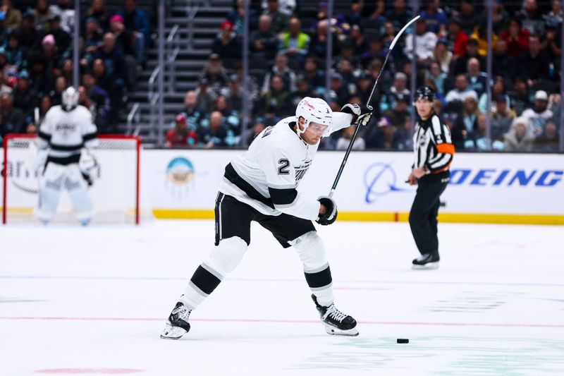 Dec 10, 2025; Seattle, Washington, USA Los Angeles Kings defenseman Brian Dumoulin (2) passes the puck in the second period against the Seattle Kraken at Climate Pledge Arena. Mandatory Credit: Kevin Ng-Imagn Images