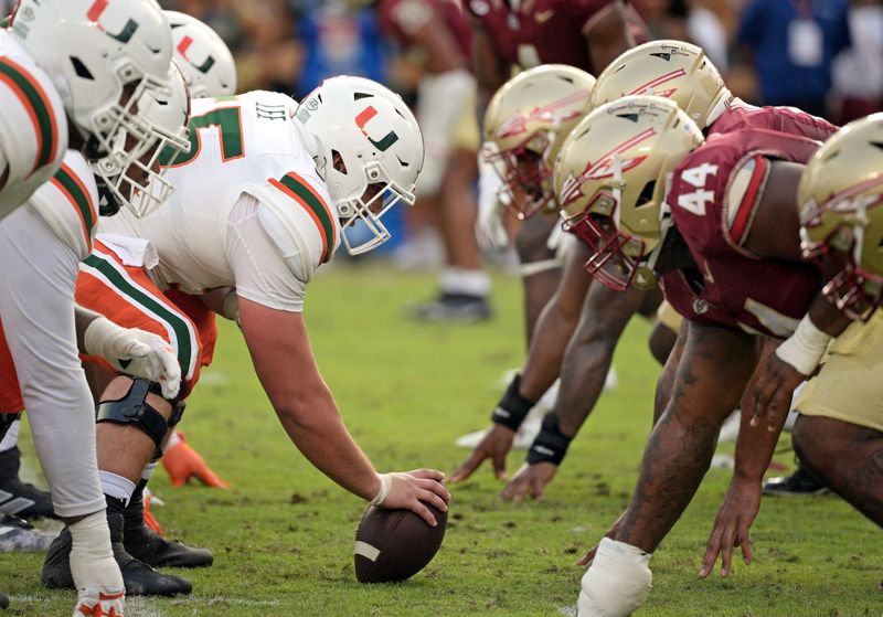 Nov 11, 2023; Tallahassee, Florida, USA; Miami Hurricanes center Matt Lee (55) about to snap the ball during the game against the Florida State Seminoles at Doak S. Campbell Stadium. Mandatory Credit: Melina Myers-USA TODAY Sports