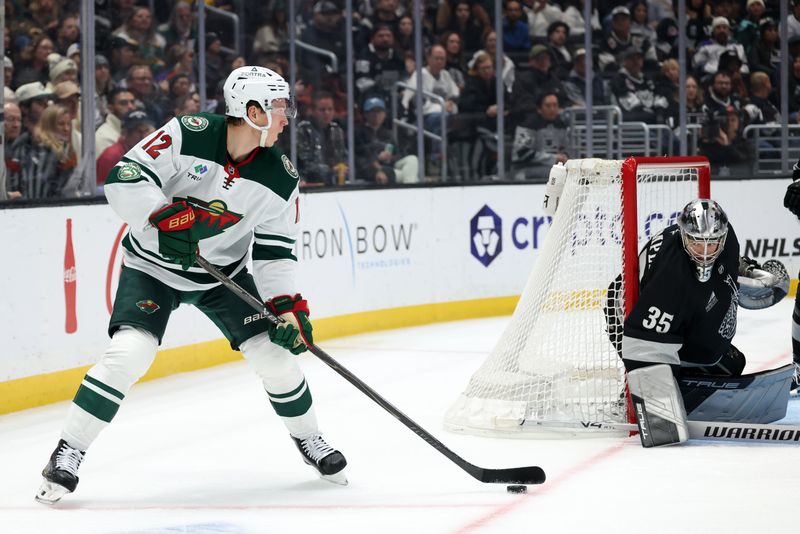 Jan 3, 2026; Los Angeles, California, USA;  Minnesota Wild left wing Matt Boldy (12) looks to shoot against Los Angeles Kings goaltender Darcy Kuemper (35) during the third period at Crypto.com Arena. Mandatory Credit: Kiyoshi Mio-Imagn Images