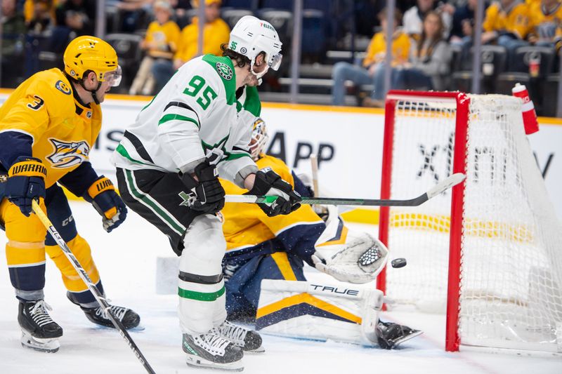 Feb 15, 2024; Nashville, Tennessee, USA; Nashville Predators (95) skates and scores past Nashville Predators goalie Kevin Lankinen (32) during the second period at Bridgestone Arena. Mandatory Credit: Steve Roberts-USA TODAY Sports