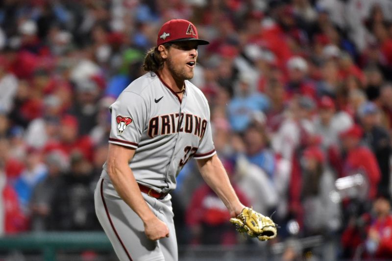 Oct 24, 2023; Philadelphia, Pennsylvania, USA; Arizona Diamondbacks relief pitcher Kevin Ginkel (37) reacts after an out against the Philadelphia Phillies in the eighth inning during game seven of the NLCS for the 2023 MLB playoffs at Citizens Bank Park. Mandatory Credit: Eric Hartline-USA TODAY Sports