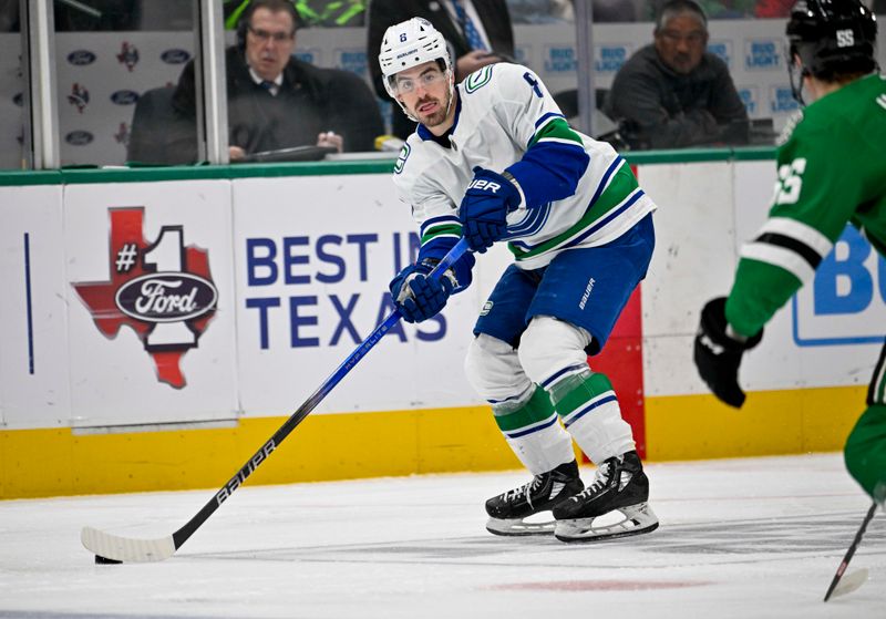 Dec 21, 2023; Dallas, Texas, USA; Vancouver Canucks right wing Conor Garland (8) skates against the Dallas Stars during the third period at the American Airlines Center. Mandatory Credit: Jerome Miron-USA TODAY Sports