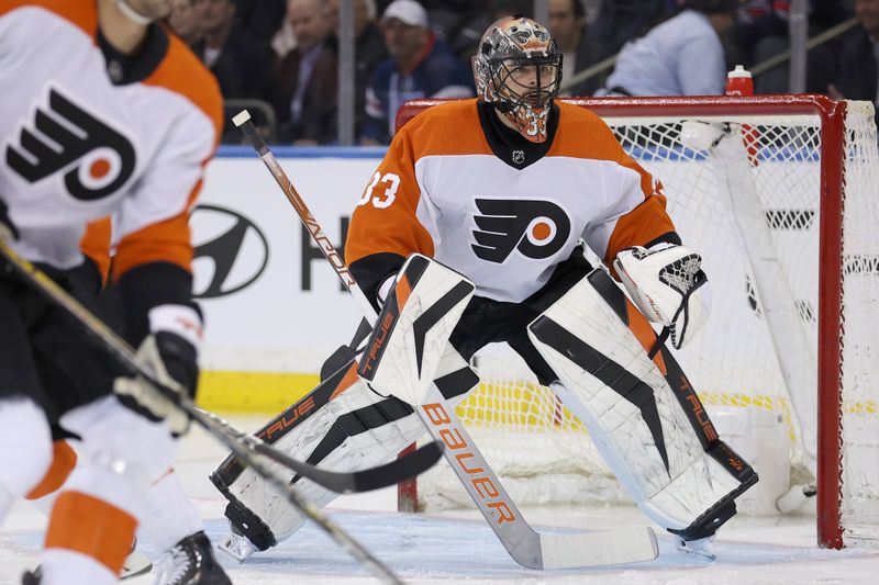 Mar 26, 2024; New York, New York, USA; Philadelphia Flyers goaltender Samuel Ersson (33) tends net against during the first period against the New York Rangers at Madison Square Garden. Mandatory Credit: Brad Penner-USA TODAY Sports