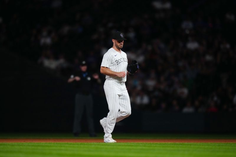 May 29, 2024; Denver, Colorado, USA; Colorado Rockies pitcher Tyler Kinley (40) enters the field the ninth inning against the Cleveland Guardians at Coors Field. Mandatory Credit: Ron Chenoy-USA TODAY Sports