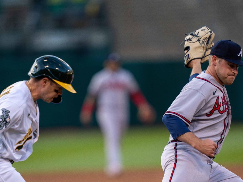 May 30, 2023; Oakland, California, USA;  Oakland Athletics shortstop Nick Allen (2) is forced out at first base by Atlanta Braves starting pitcher Bryce Elder (55) during the third inning at Oakland-Alameda County Coliseum. Mandatory Credit: Neville E. Guard-USA TODAY Sports