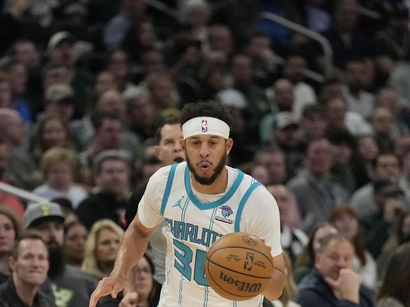 MILWAUKEE, WISCONSIN - FEBRUARY 27: Seth Curry #30 of the Charlotte Hornets dribbles the ball during the first half against the Milwaukee Bucks at Fiserv Forum on February 27, 2024 in Milwaukee, Wisconsin. NOTE TO USER: User expressly acknowledges and agrees that, by downloading and or using this photograph, User is consenting to the terms and conditions of the Getty Images License Agreement. (Photo by Patrick McDermott/Getty Images)