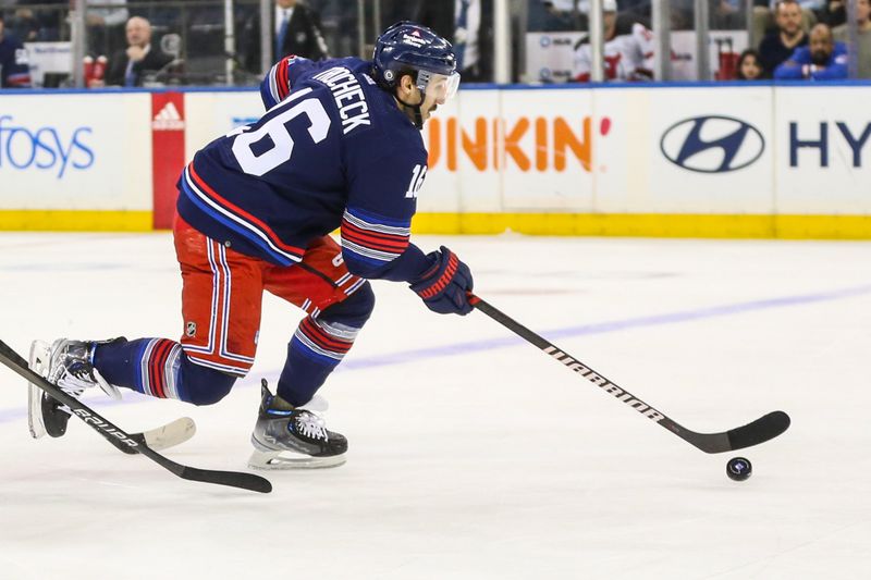 Apr 3, 2024; New York, New York, USA; New York Rangers center Vincent Trocheck (16) controls the puck in the first period against the New Jersey Devils at Madison Square Garden. Mandatory Credit: Wendell Cruz-USA TODAY Sports