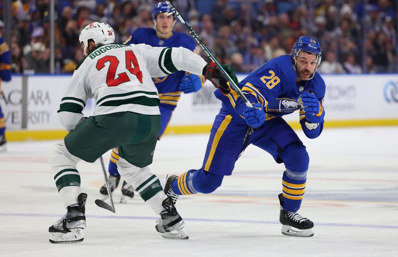 Nov 10, 2023; Buffalo, New York, USA;  Buffalo Sabres left wing Zemgus Girgensons (28) goes after a loose puck during the second period against the Minnesota Wild at KeyBank Center. Mandatory Credit: Timothy T. Ludwig-USA TODAY Sports