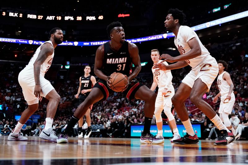 MIAMI, FLORIDA - MARCH 24: Thomas Bryant #31 of the Miami Heat drives against Damian Jones #30 of the Cleveland Cavaliers during the fourth quarter at Kaseya Center on March 24, 2024 in Miami, Florida. NOTE TO USER: User expressly acknowledges and agrees that, by downloading and or using this photograph, User is consenting to the terms and conditions of the Getty Images License Agreement. (Photo by Rich Storry/Getty Images)