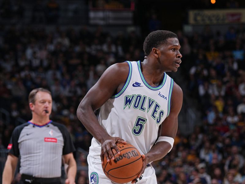 DENVER, CO - MARCH 29: Anthony Edwards #5 of the Minnesota Timberwolves handles the ball during the game against the Denver Nuggets on March 29, 2024 at the Ball Arena in Denver, Colorado. NOTE TO USER: User expressly acknowledges and agrees that, by downloading and/or using this Photograph, user is consenting to the terms and conditions of the Getty Images License Agreement. Mandatory Copyright Notice: Copyright 2024 NBAE (Photo by Bart Young/NBAE via Getty Images)