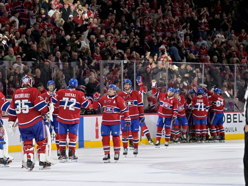 Nov 1, 2025; Montreal, Quebec, CAN; Montreal Canadiens forward Alex Newhook (15) celebrates with teammates after scoring the winning goal against the Ottawa Senators during the overtime period at the Bell Centre. Mandatory Credit: Eric Bolte-Imagn Images