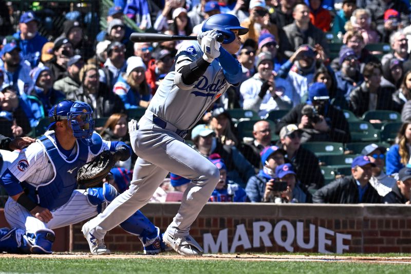 Apr 5, 2024; Chicago, Illinois, USA;  Los Angeles Dodgers two-way player Shohei Ohtani (17) hits a double against the Chicago Cubs during the first inning at Wrigley Field. Mandatory Credit: Matt Marton-USA TODAY Sports