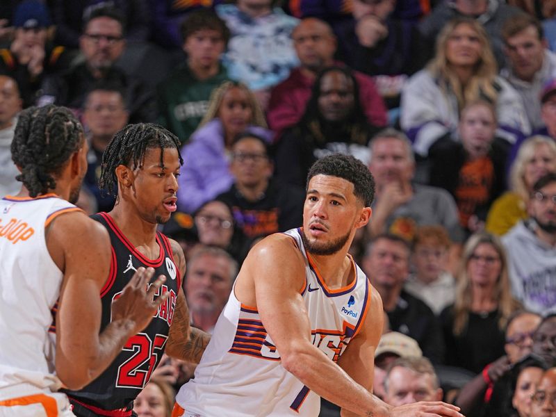 PHOENIX, AZ - JANUARY 22: Devin Booker #1 of the Phoenix Suns looks to pass the ball during the game against the Chicago Bulls on January 22, 2024 at Footprint Center in Phoenix, Arizona. NOTE TO USER: User expressly acknowledges and agrees that, by downloading and or using this photograph, user is consenting to the terms and conditions of the Getty Images License Agreement. Mandatory Copyright Notice: Copyright 2024 NBAE (Photo by Garrett Ellwood/NBAE via Getty Images)