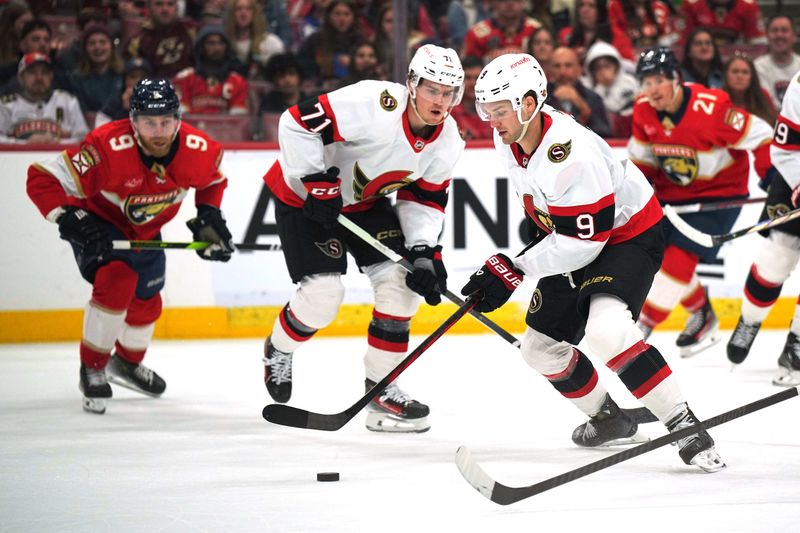 Feb 20, 2024; Sunrise, Florida, USA; Ottawa Senators center Josh Norris (9) tries to keep the puck in the Florida Panthers zone during the first period at Amerant Bank Arena. Mandatory Credit: Jim Rassol-USA TODAY Sports